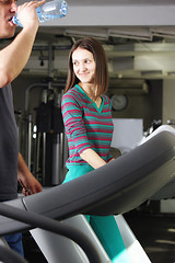 Image showing Smiling woman on treadmill