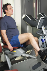 Image showing Man at workout on bicycle machine