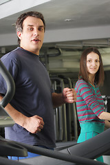 Image showing Man and woman on treadmills