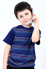 Image showing Small boy calling from mobile phone