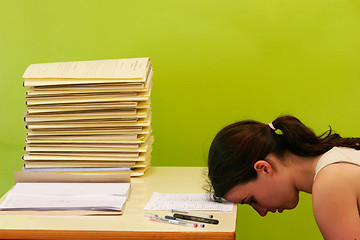 Image showing woman has stress because of huge work on her desk