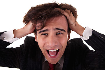 Image showing Strongly afflicted young businessman keeps hands for head