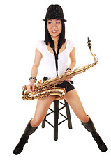 Image showing Chinese girl playing the saxophone.