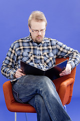 Image showing Man reads business papers