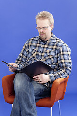 Image showing Man reads business papers