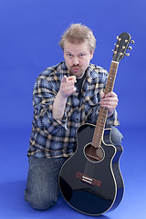 Image showing Portrait Of A Man With Guitar