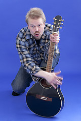 Image showing Man plays guitar