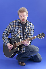 Image showing Portrait Of A Man With Guitar