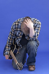 Image showing Portrait Of A Tired Guitarist