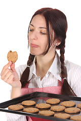 Image showing housewife eating a slice of chocolate cake 