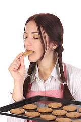 Image showing housewife eating a slice of chocolate cake 