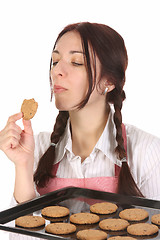 Image showing housewife eating a slice of chocolate cake 