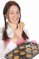 Image showing housewife eating a slice of chocolate cake 