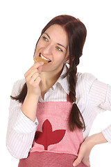 Image showing housewife eating a slice of chocolate cake 