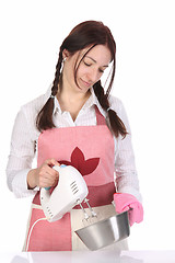 Image showing beautiful housewife preparing with kitchen mixer 