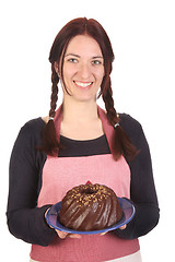 Image showing housewife showing off bundt cake 