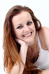 Image showing Lying and smiling attractive woman 