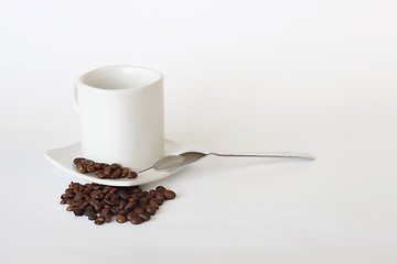 Image showing coffee mug spoon spilled coffee on white 