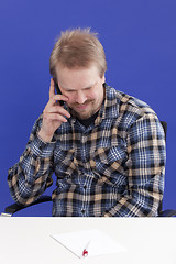 Image showing Man Takes A Personal Phone Call