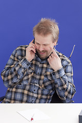 Image showing Man Takes A Personal Phone Call