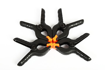 Image showing plastic clamps composition on white background