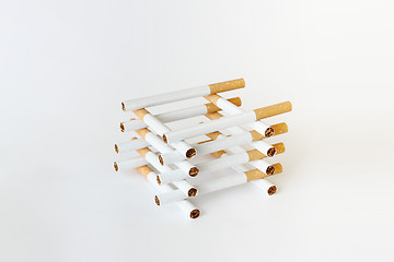 Image showing composition of cigarettes on white background 