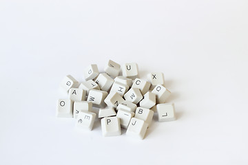 Image showing scattered keyboard keys on white 