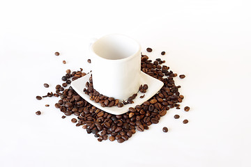 Image showing coffee mug spoon with spilled coffee on white 