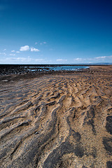 Image showing Black and sand beach