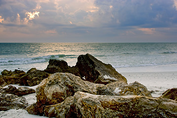 Image showing rocks on the beach at sunset