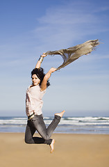 Image showing pretty happy girl jumping