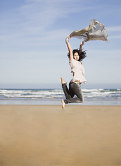 Image showing pretty happy girl jumping