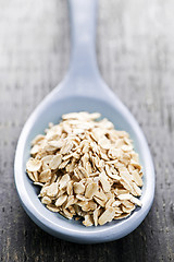 Image showing Spoon of uncooked rolled oats