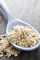 Image showing Spoon of uncooked rolled oats