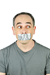 Image showing Man with duct tape on mouth