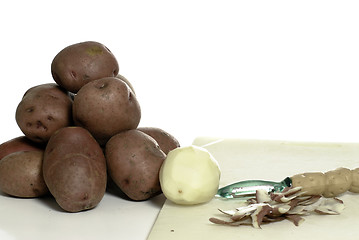 Image showing Peeling Potatoes
