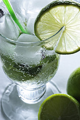 Image showing Mojito cocktail and limes above view