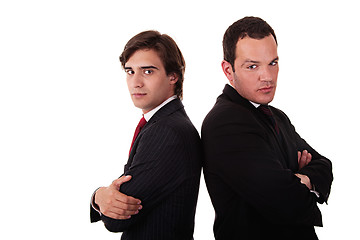 Image showing two businessman standing back to back