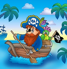 Image showing Cartoon pirate paddling in boat