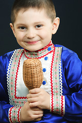 Image showing Little boy playing maracas