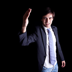 Image showing young businessman waving