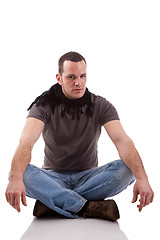 Image showing handsome man, sitting on the floor