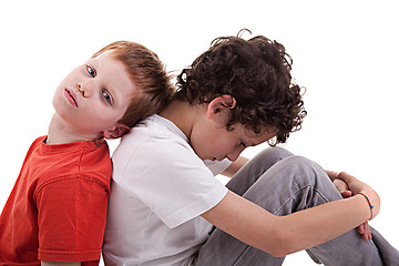 Image showing Young boy back to back, sitting