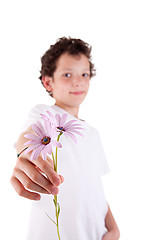 Image showing cute boy offering flowers