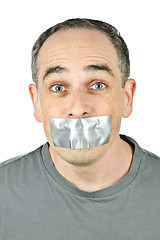 Image showing Man with duct tape on mouth