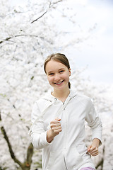 Image showing Girl jogging in park