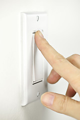 Image showing Turning off light switch