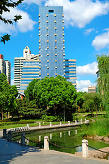 Image showing Office building beside city park