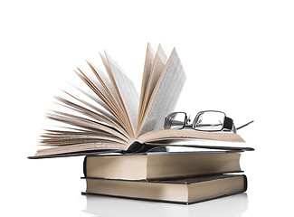 Image showing pile of books and eyeglasses