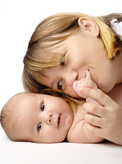 Image showing Mother kissing her child's hand